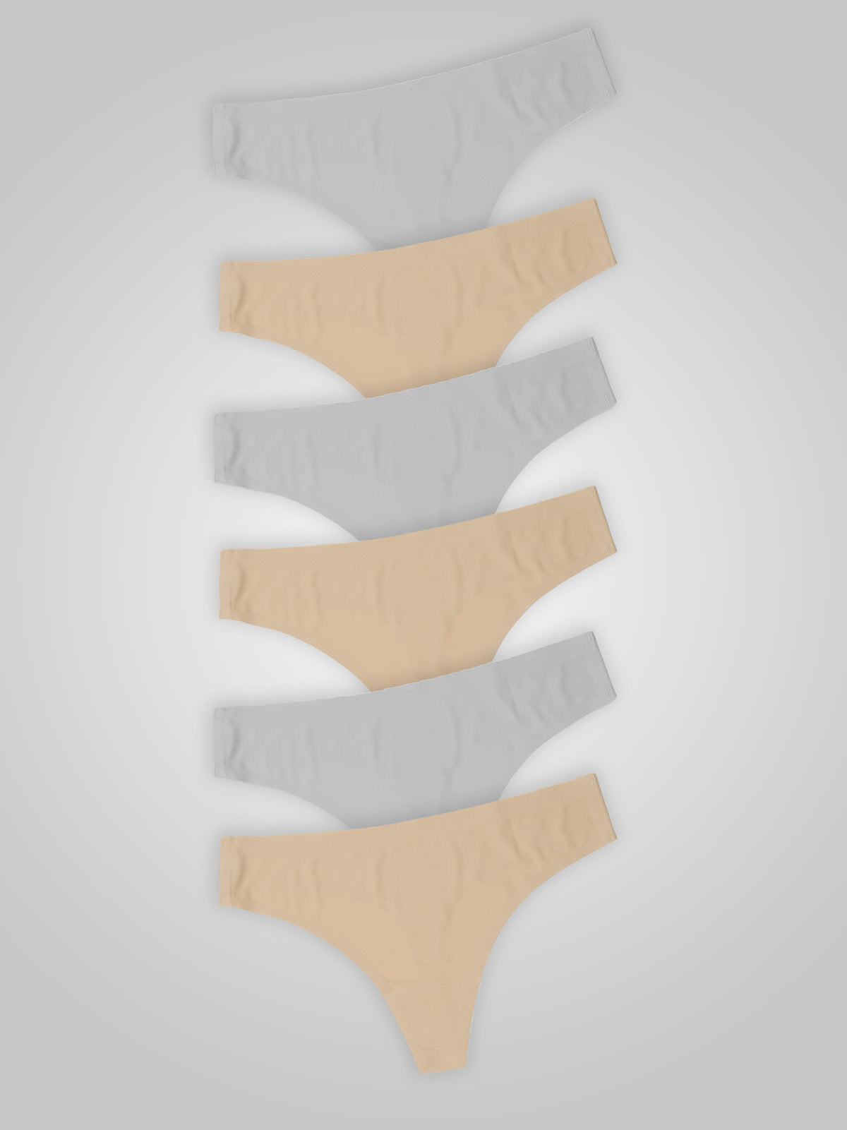 Kit com 6 Calcinhas Fio Dental Sem Costura Segunda Pele (3 Branco e 3 Bege) - R$20,82 cada