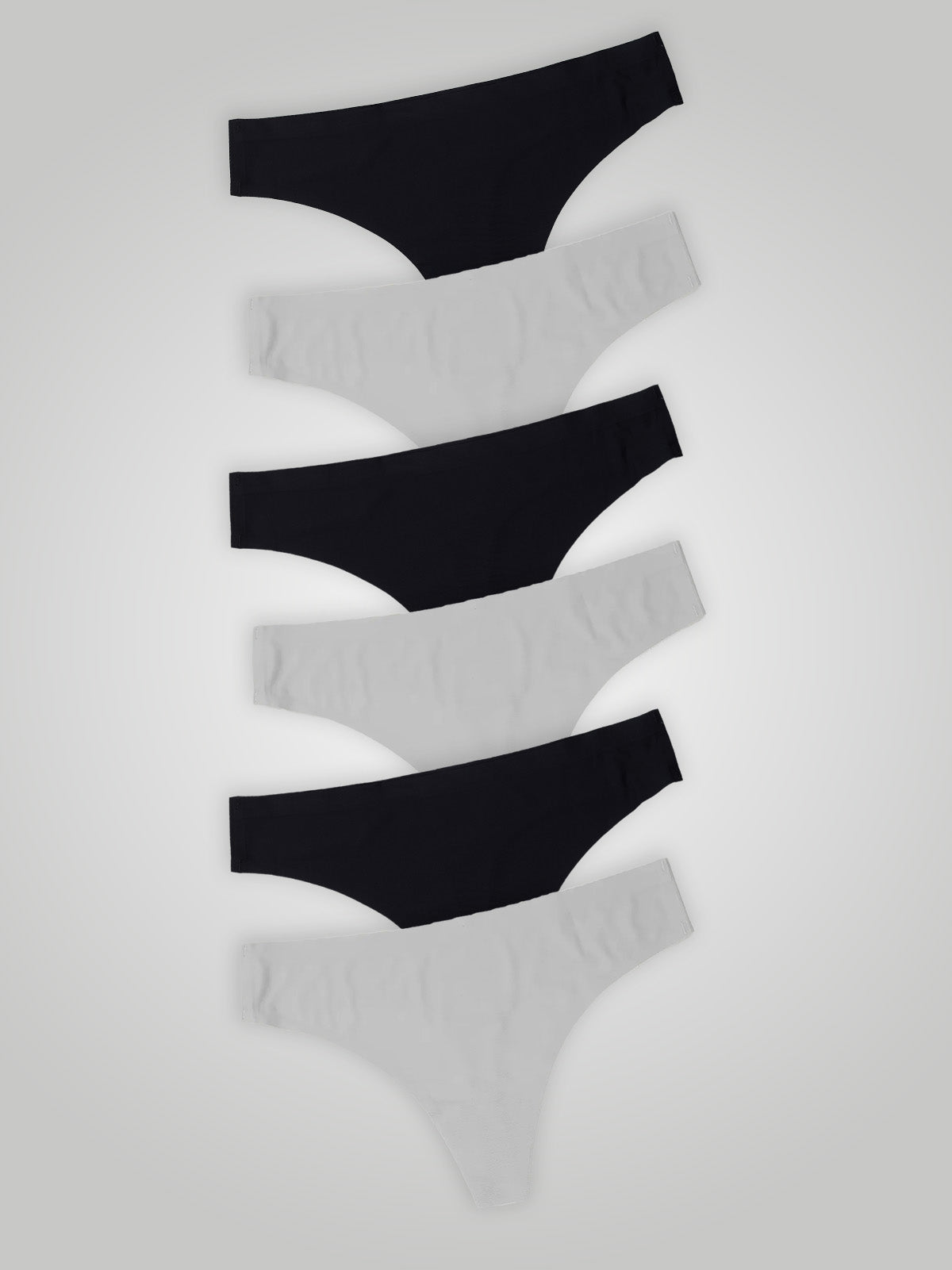 Kit com 6 Calcinhas Fio Dental Sem Costura Segunda Pele (3 Preto e 3 Branco) - R$20,82 cada