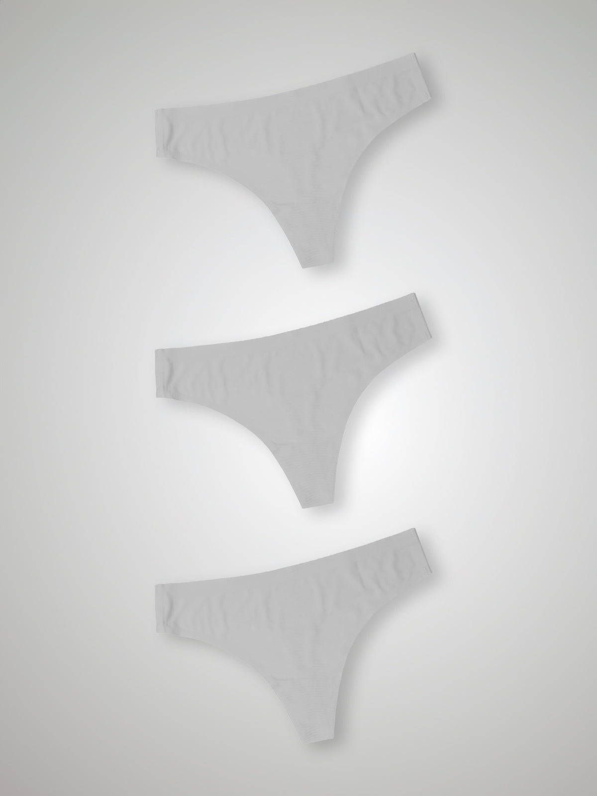 Kit com 3 Calcinhas Fio Dental Sem Costura Segunda Pele Branco - R$23,30 cada