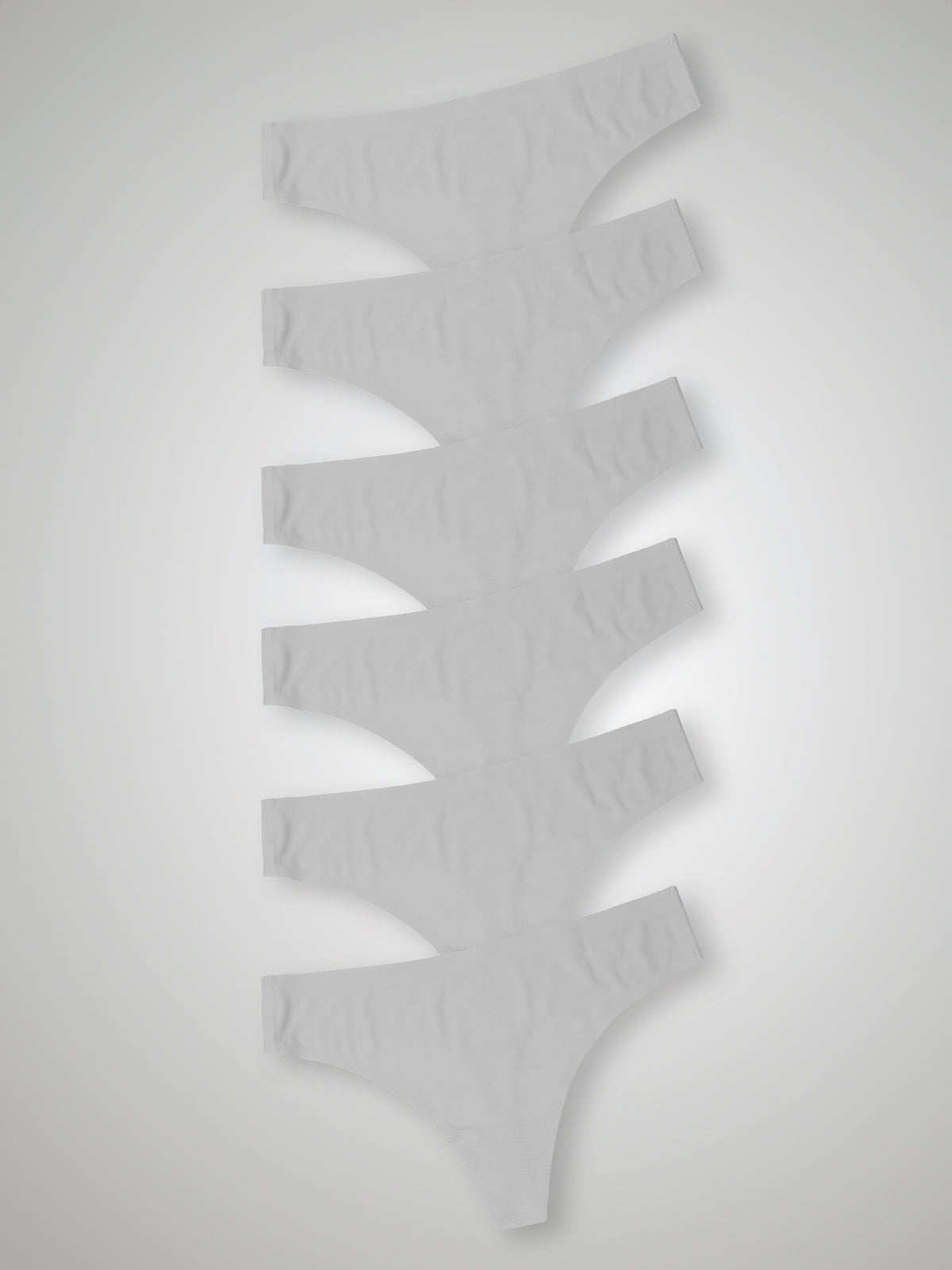 Kit com 6 Calcinhas Fio Dental Sem Costura Segunda Pele Branco - R$23,98 cada